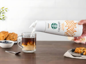 Pouring Starbucks creamer